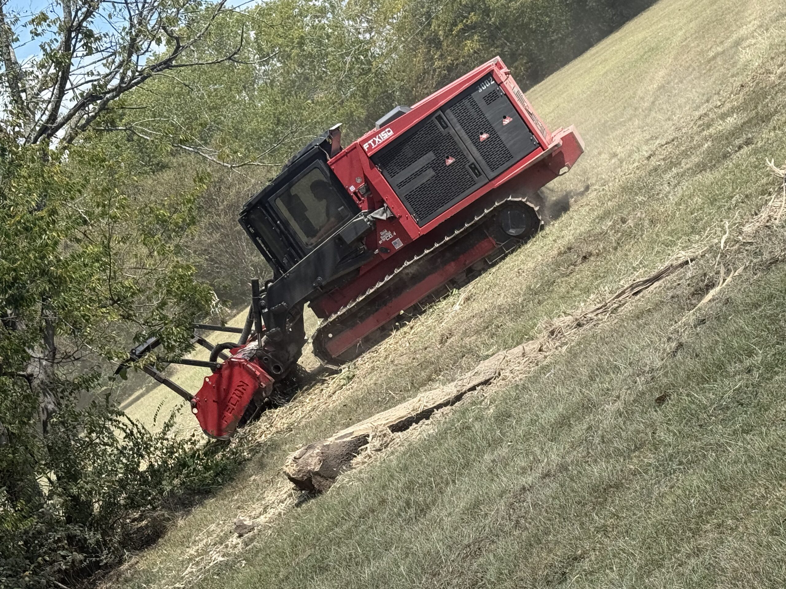 Forestry mulcher clearing a sloped property