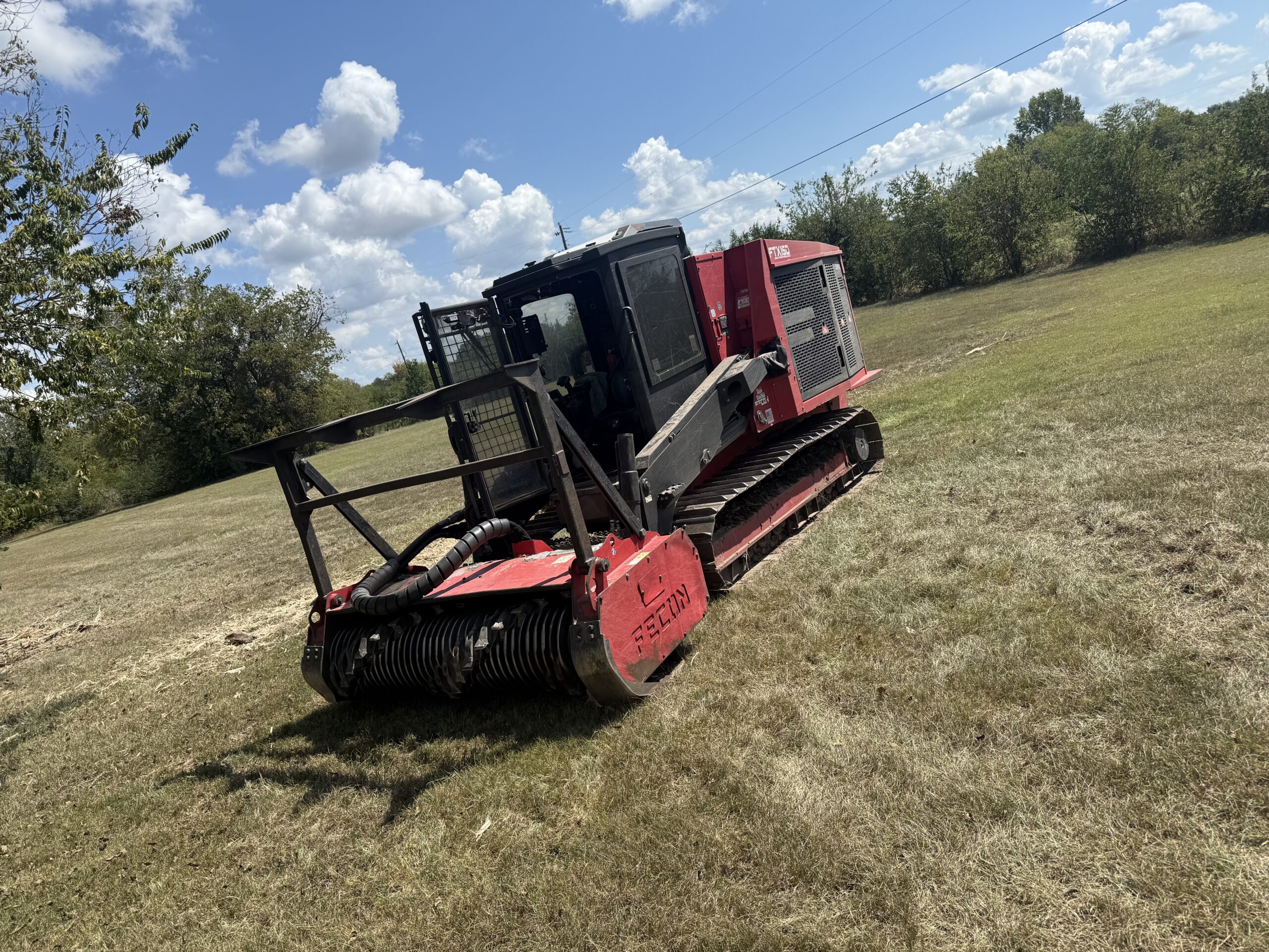 Forestry mulcher working an open field