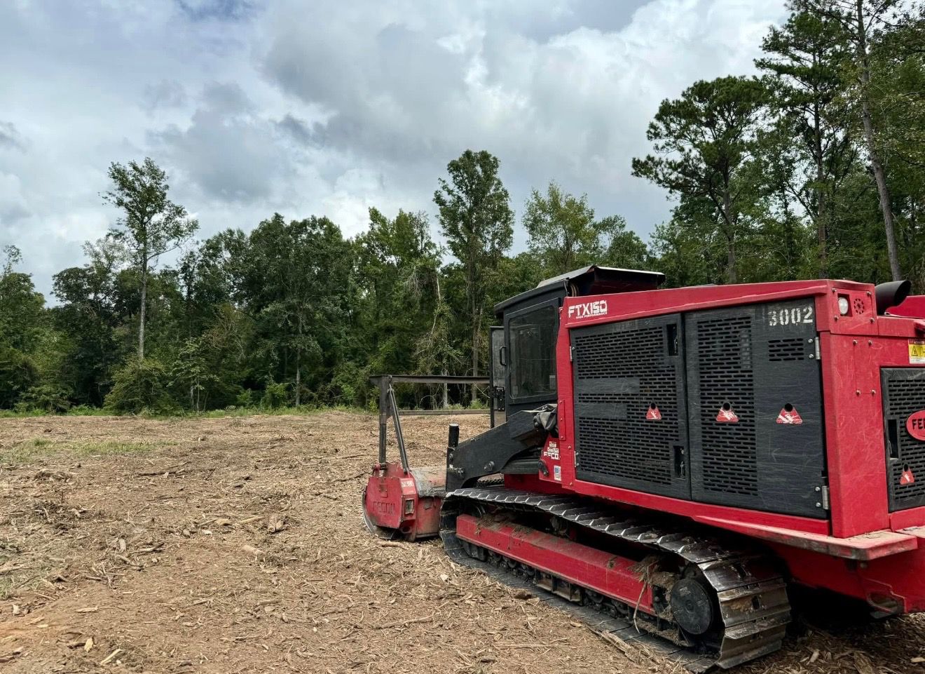 Forestry mulching equipment working a property